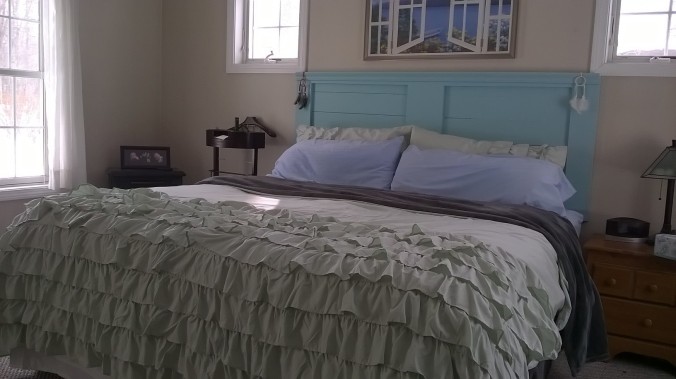 My coastal-colored bed. My husband hates the ruffles. I think they make it look romantic.